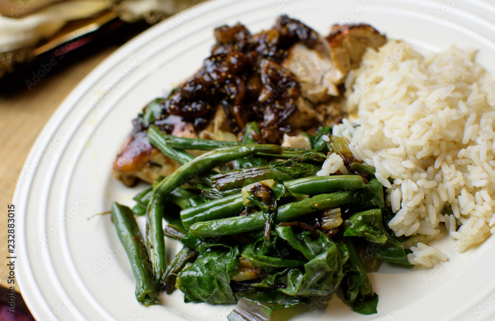 Closeup of healthy green beans with kale and swiss chard roasted vegetables on plate with rice and food ready to eat Closeup of healthy green beans with kale and swiss chard roasted vegetables on plate with rice and food ready to eat