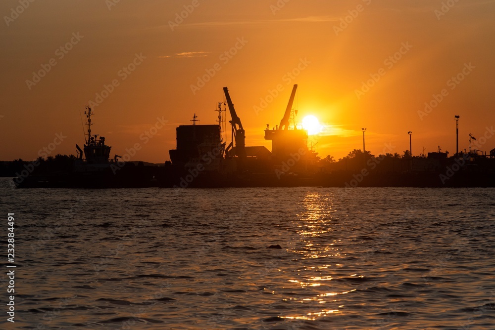 Sunset in industrial port