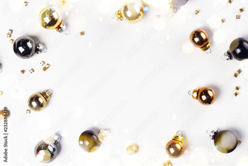 Christmas flat lay frame with golden, gray and black glass balls with copy space Christmas flat lay frame with golden, gray and black glass balls with copy space