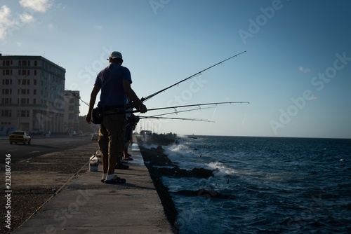 Fishermen fishing at sunset