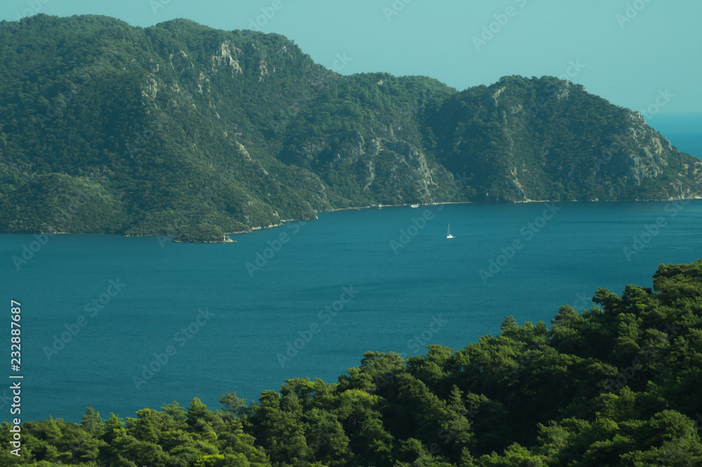 Landscape with the mountains and islands. Seascape background. water surface in a bay