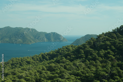 Landscape with the mountains and islands. Seascape background. water surface in a bay © maxkolmeto