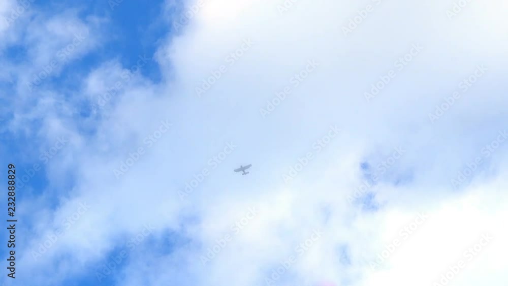 Athletes parachute from an airplane flying high in the sky. Athletes parachute from an airplane flying high in the sky.