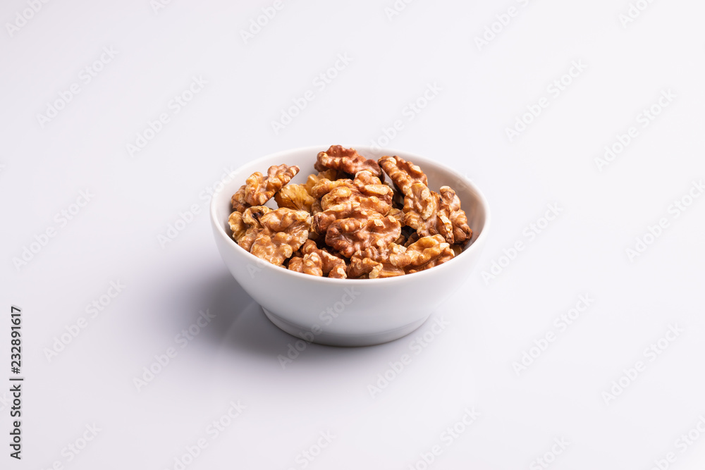 walnuts in bowl isolated on white background walnuts in bowl isolated on white background