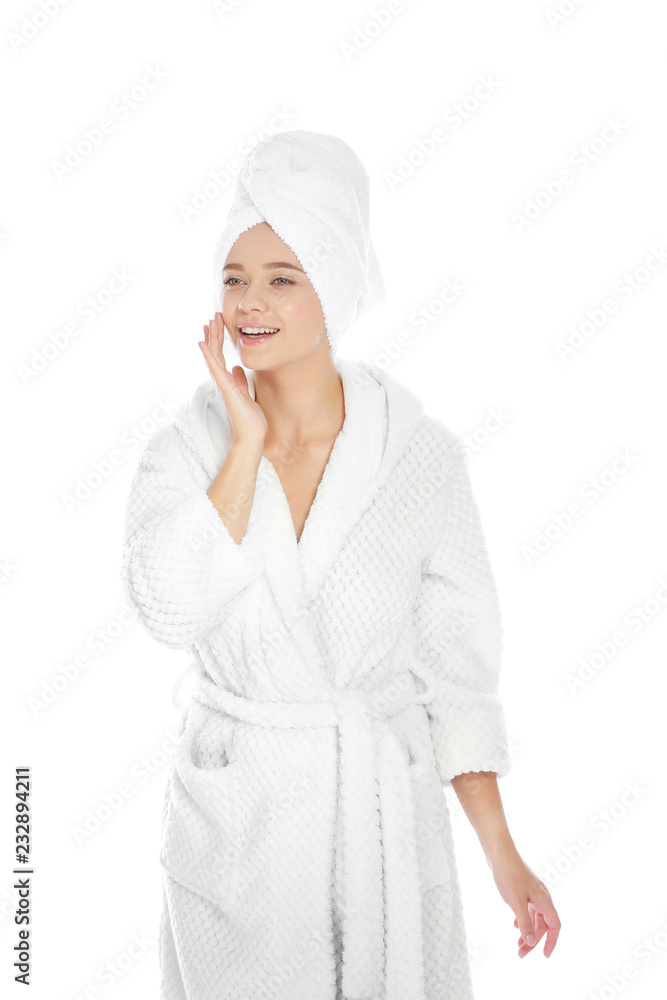 Portrait of young pretty woman in bathrobe with towel on white background Portrait of young pretty woman in bathrobe with towel on white background