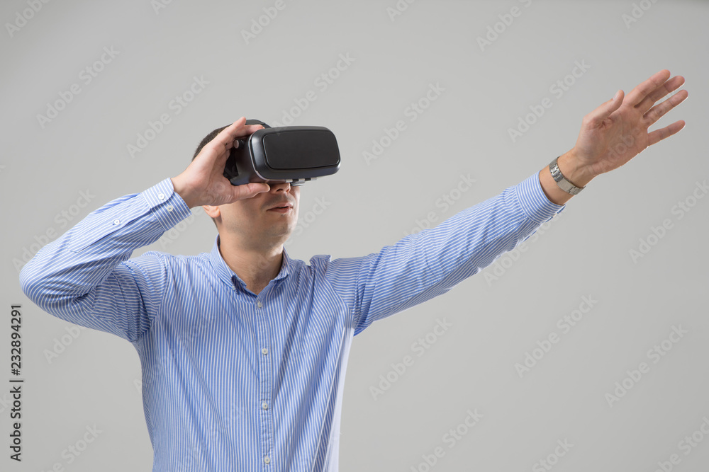Man uses a virtual reality glasses. VR 360. Virtual game Man uses a virtual reality glasses. VR 360. Virtual game