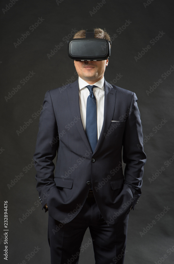 Man in black suit uses a virtual reality glasses.  VR 360. Virtual game