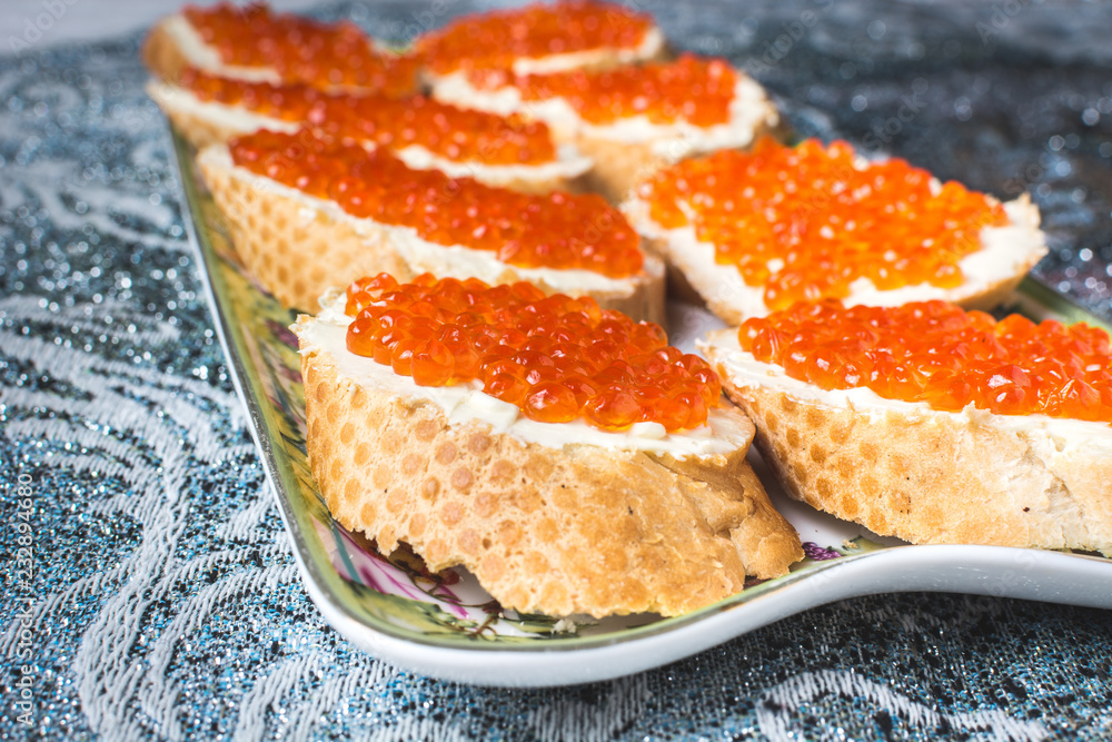 Sandwiches with red ROE and butter plate holiday table Sandwiches with red ROE and butter plate holiday table