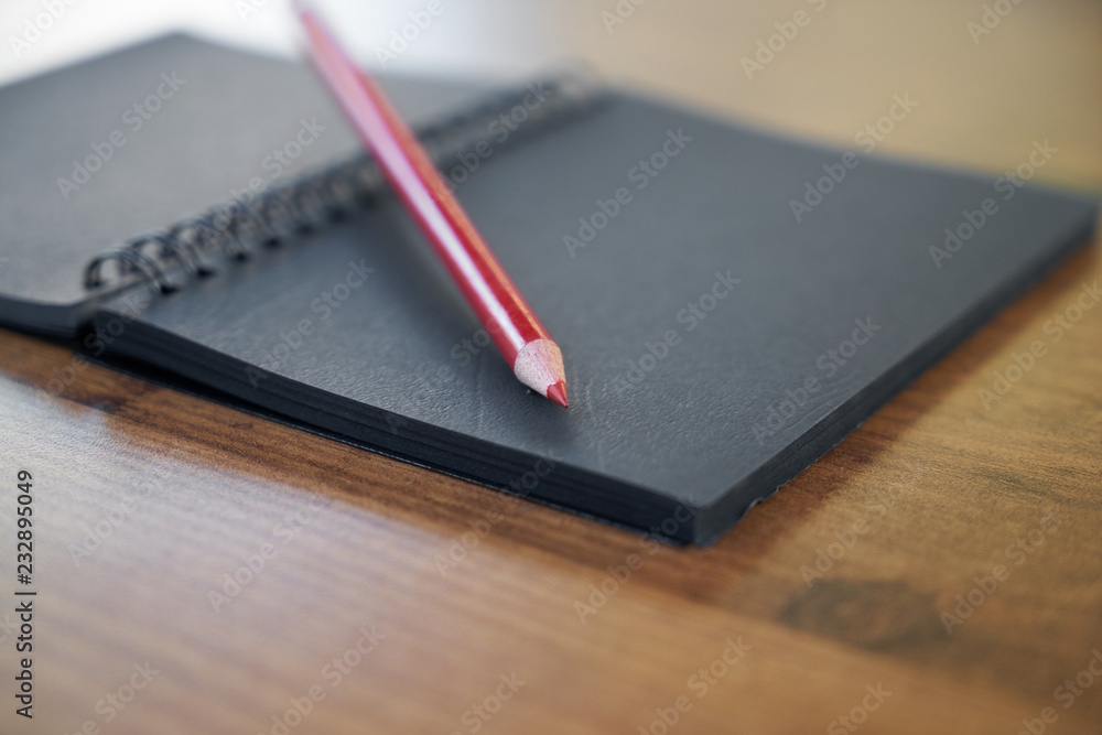 pen and notepad on the table pen and notepad on the table