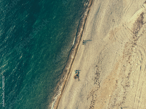 Aerial view of sea waves and cosast line or beach from above photo