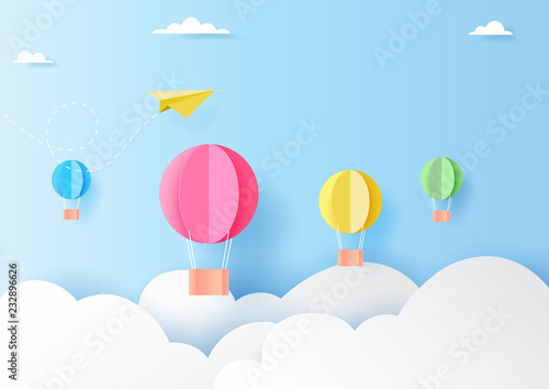Colorful hot air balloons on blue sky paper art style