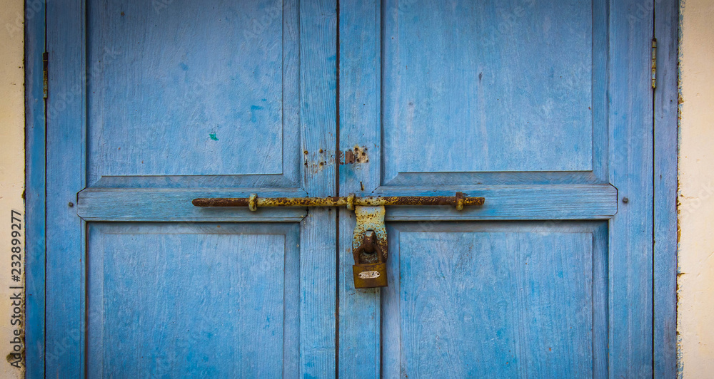 old wooden door with rusty lock from antique building,vintage old wooden door with rusty lock from antique building,vintage