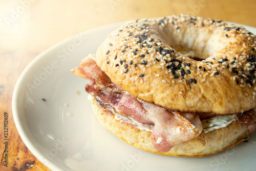 Bagel sandwiches with cream cheese and fried bacon