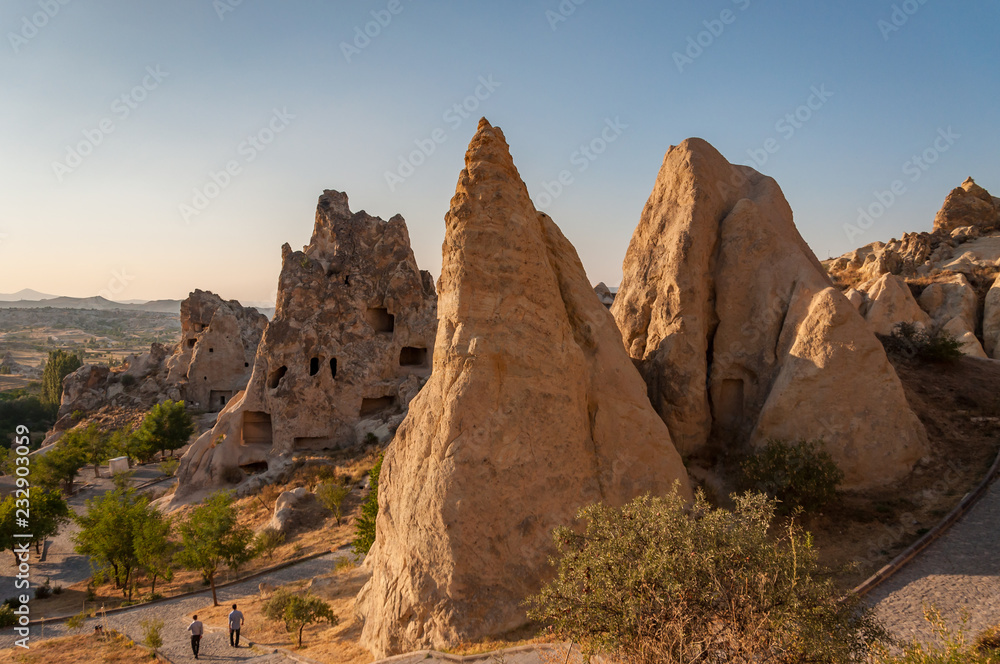 A detail from the structure of Cappadocia. Impressive fairy chimneys of sandstone in the canyon near Cavusin village, Cappadocia, Nevsehir Province in the Central Anatolia Region of Turkey. Clear sky.