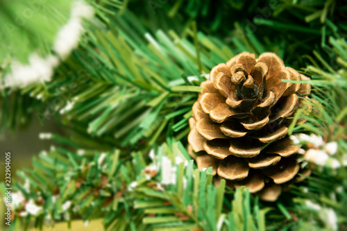 Christmas ball on tree. Closeup on Christmas tree decoration over festive background