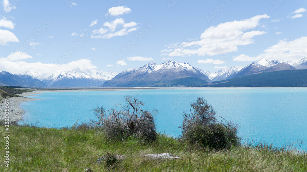 Turquoise lake Te Kapo with mountains behind, New Zealand