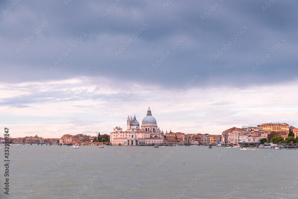 VENICE, ITALY- OCTOBER 30, 2018: view of Punta della Dogana and of the Basílica de Santa Maria della Salute VENICE, ITALY- OCTOBER 30, 2018: view of Punta della Dogana and of the Basílica de Santa Maria della Salute