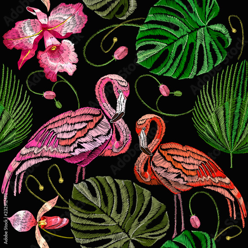 Embroidery flamingo, palm tree leaves, tropical seamless pattern. Fashionable template for design of clothes. Tropical embroidery pink flamingos, summer background