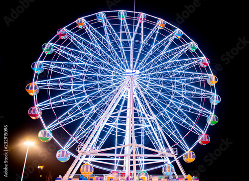   The ferris wheel of the night amusement park