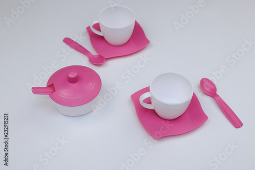 children's toy dishes for tea on a white background