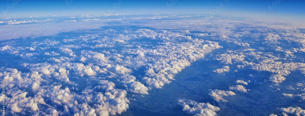 Aerial Cloudscape view over midwest states on flight over Colorado, Kansas, Missouri, Illinois, Indiana, Ohio and West Virginia during autumn. Grand sweeping views of landscape and clouds. Views of cr