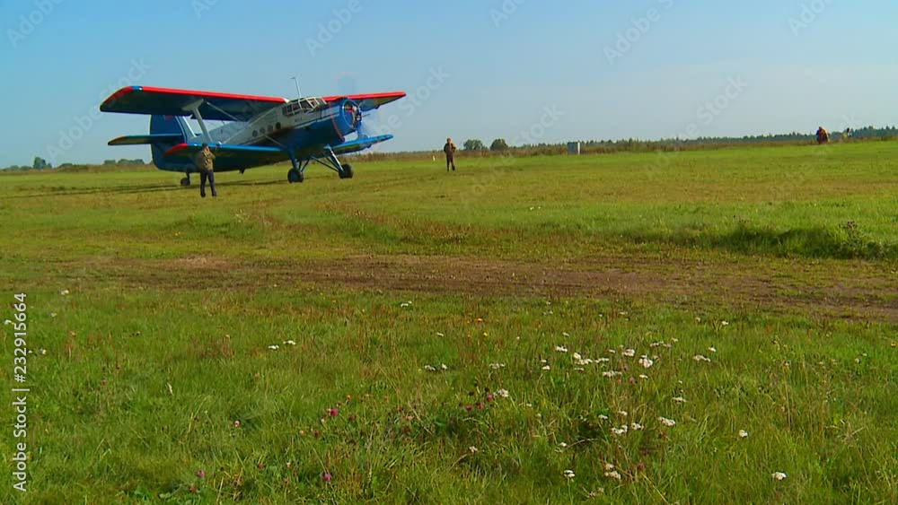 Summer sunny day, athletes jump with a parachute from a small passenger plane. Summer sunny day, athletes jump with a parachute from a small passenger plane.