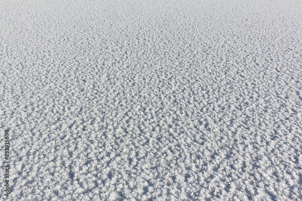 Snow frost on the ice on the river, natural background Snow frost on the ice on the river, natural background