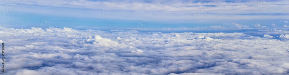 Aerial Cloudscape view over midwest states on flight over Colorado, Kansas, Missouri, Illinois, Indiana, Ohio and West Virginia during autumn. Grand sweeping views of landscape and clouds. Views of cr