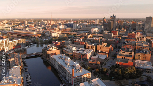 Milwaukee river in downtown, harbor districts of Milwaukee, Wisconsin, United States. Real estate, condos in downtown. Aerial view, drone flying