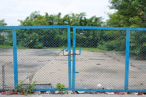 chain link fence and metal door with lock