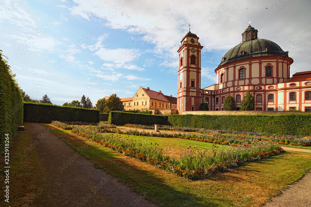 Classic wide-angle view of amazing cathedral and scenic garden in famous baroque palace Jaromerice nad Rokytnou. South Moravia, Czech Republic, Central Europe