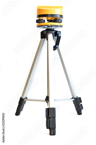 Construction tool-metal tripod with yellow head for laser level. White background, isolated
