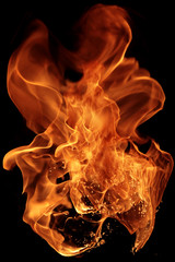 magical fire ignition - burning red-orange hot flame - fiery elements isolated on a black background