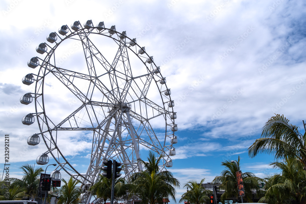 Fototapeta premium Blue sky with ferris wheel
