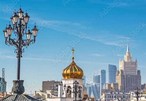 The diverse architecture of Moscow - houses, bell tower, skyscrapers, lanterns.