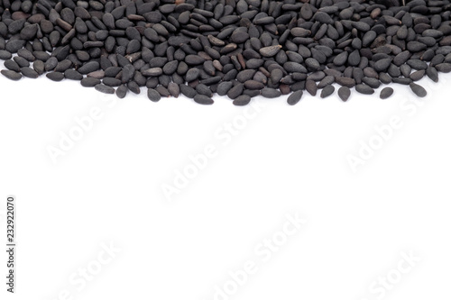 Close up black organic sesame on white background. Health food concept.
