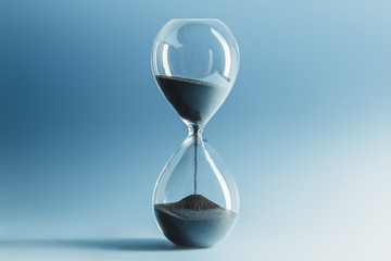 Hourglass on blue background