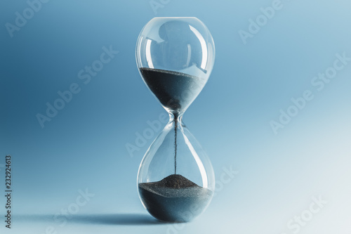 Hourglass on blue background