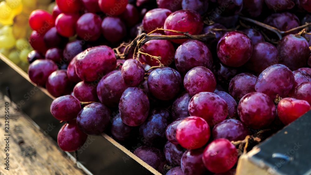 Grape, bunch, red grapes, fresh raw lot, store window Grape, bunch, red grapes, fresh raw lot, store window