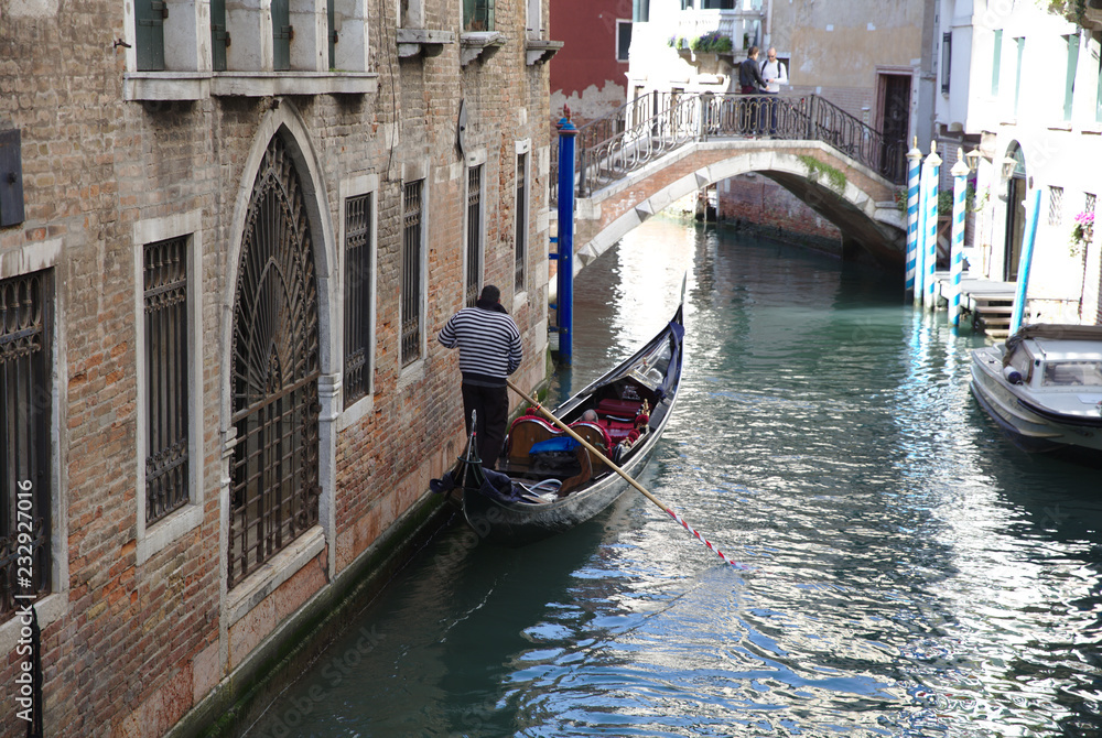 Gondolier in canal in Venice 4366