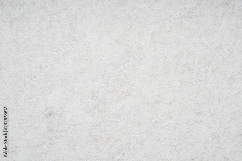 light gray or off-white felt background with fiber texture photo