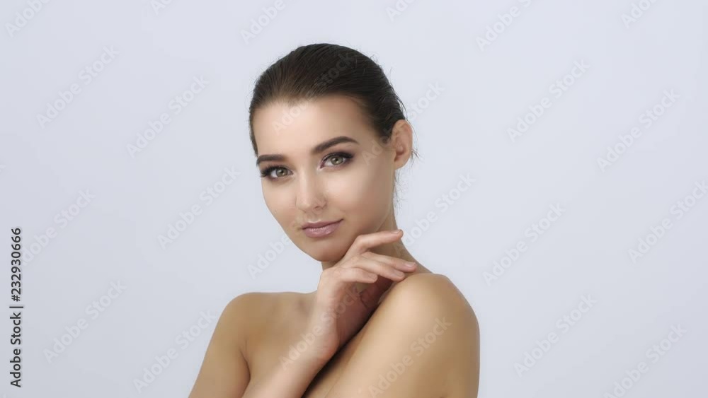 Beautiful healthy woman touching smooth skin on face. Youth and Skin Care Concept. Close up. Slow motion 4K UHD high quality sharp footage. Beautiful healthy woman touching smooth skin on face. Youth and Skin Care Concept. Close up. Slow motion 4K UHD high quality sharp footage.