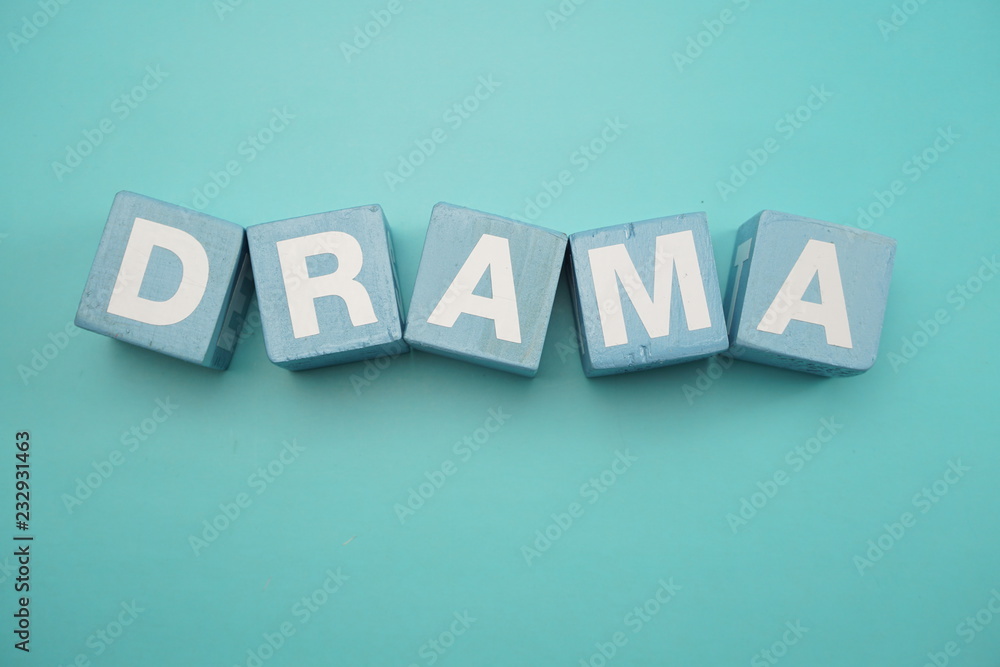 Obraz premium Drama word created with cubes alphabet letters on blue background