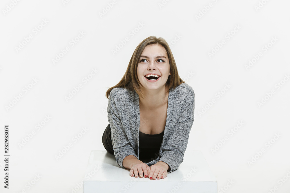 Delight. Beautiful female portrait isolated on white studio backgroud. Young, emotional, smiling woman. Human emotions, facial expression concept. Delight. Beautiful female portrait isolated on white studio backgroud. Young, emotional, smiling woman. Human emotions, facial expression concept.