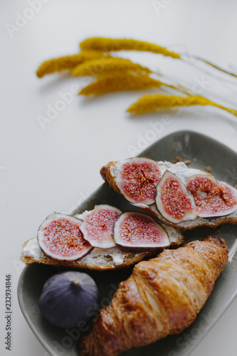 Closeup of croissant with fig