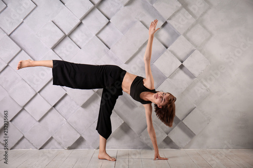Sporty woman practicing yog...