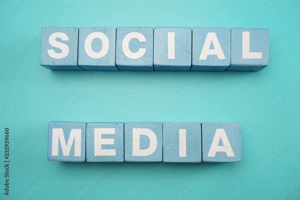 Social Media created with cubes alphabet letters on blue background Social Media created with cubes alphabet letters on blue background