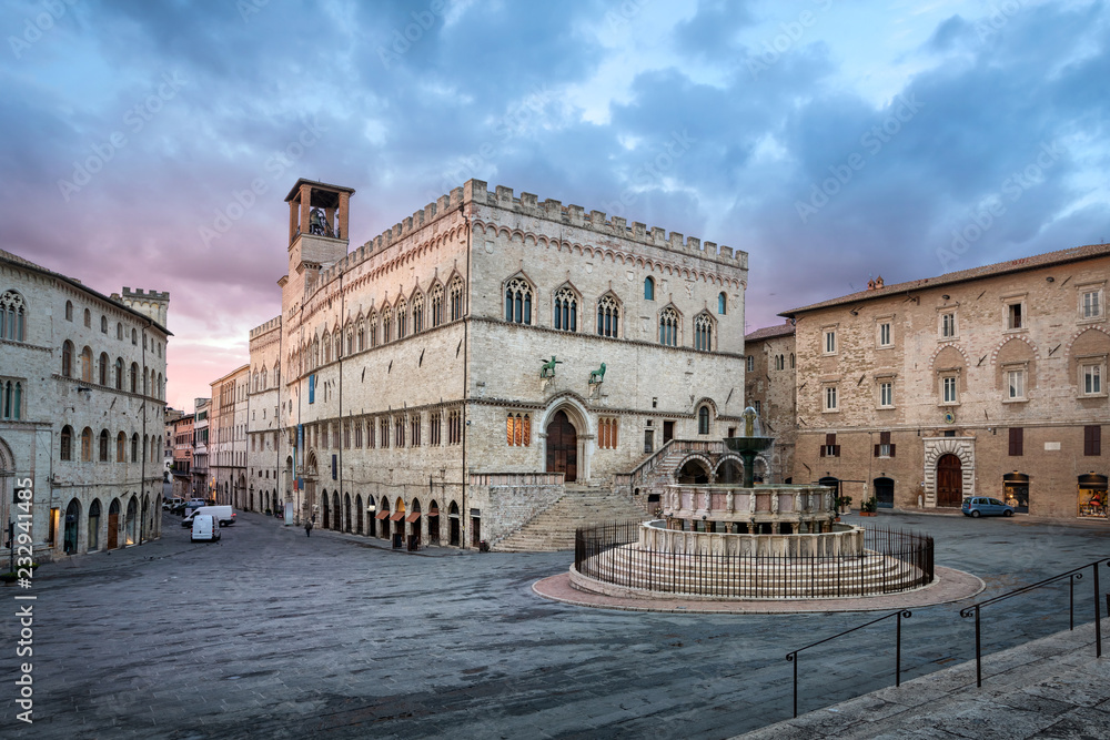 Perugia, Italy. Piazza IV Novembre on sunrise with Old Town Hall and monumental fountain Fontana Maggiore