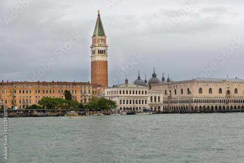 VENICE, ITALY- OCTOBER 30, 2018: St Mark's Campanile is the bell tower of St Mark's Basilica in Venicearco. It is one of the most recognizable symbols of the city. view from the sea