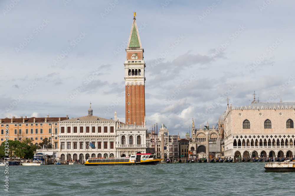 VENICE, ITALY- OCTOBER 30, 2018: St Mark's Campanile is the bell tower of St Mark's Basilica in Venicebols of the city. view from the sea